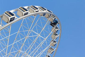 ferris wheel in the park with clear blue sky and empty space for