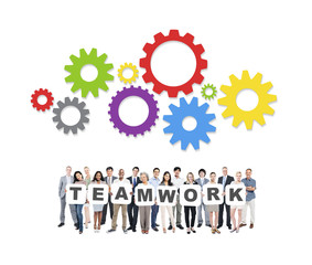 Multi-Ethnic Group Of People Holding The Word Teamwork