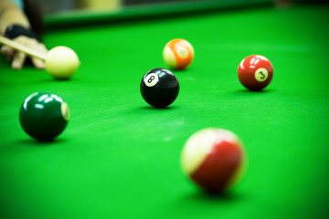 Pool game on green table