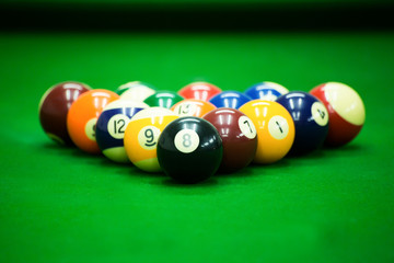 Pool game on green table