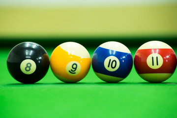 Pool game on green table