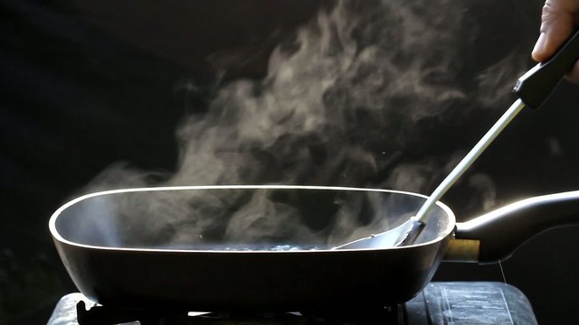 steam on pan in kitchen