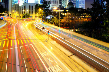 Fototapeta premium Busy traffic in city at night