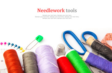 Sewing tools, thread, scissors, pins and measure type on white