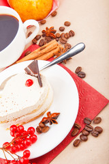 Vanilla cake with red berry and cup of coffee
