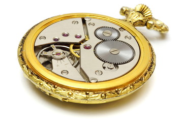 closeup of old vintage pocket gold watch isolated