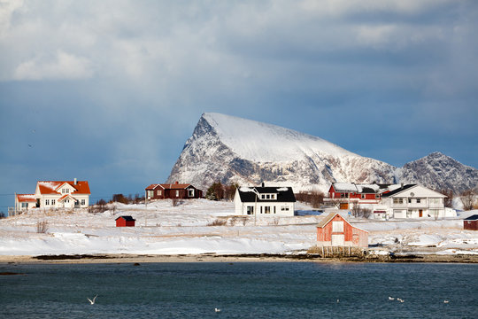 Scattered houses on a snowy island over arctic circle