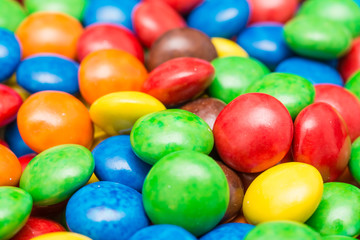 Fototapeta na wymiar Kolorowe cukierki zamknąć się w tle