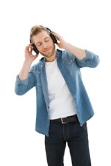 Handsome young man enjoying music