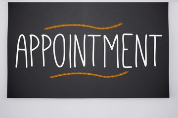 Appointment written on big blackboard