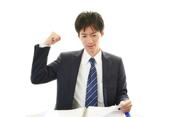 ガッツポーズのビジネスマン
