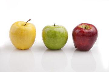 Yellow, green and red apples