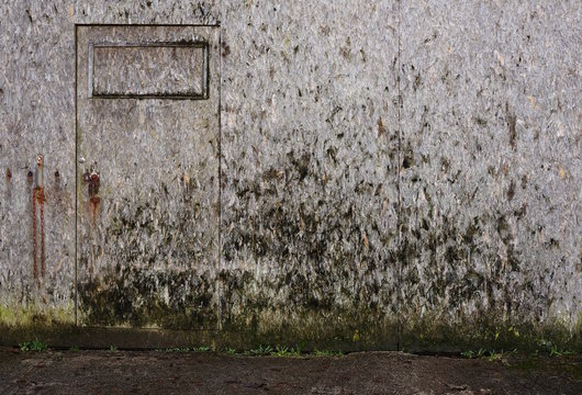 Hintergrund bewitterte Fassade aus Grobspanplatten