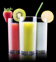 tasty summer fruits with juice in glass