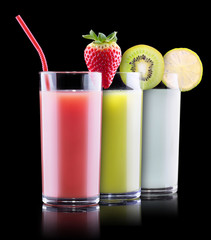 tasty summer fruits with juice in glass
