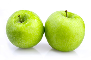 Two green apples on white background