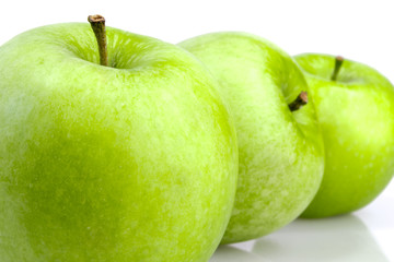 Three green apples in a row