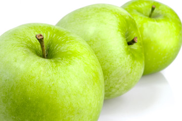 Three green apples in a row