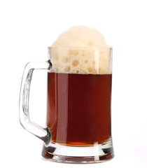 Tall big mug of brown beer with foam.