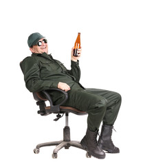 Worker in glasses sitting with beer.