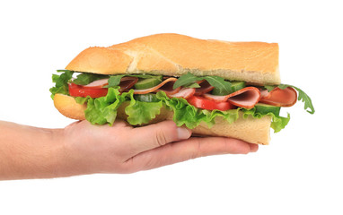 Big fresh sandwich in hands.