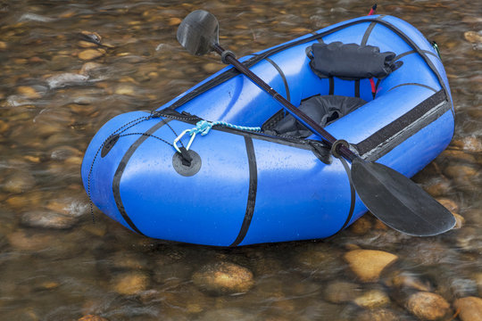 packraft with a paddle