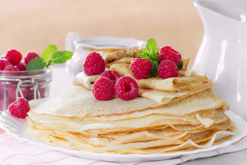 Homemade pancakes with raspberries and mint