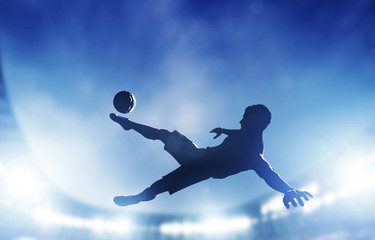 Fototapeta Football, soccer match. A player shooting on goal obraz