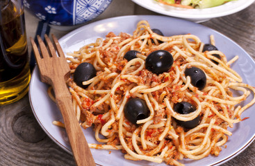 Spaghetti with meat bolognese sauce and olives