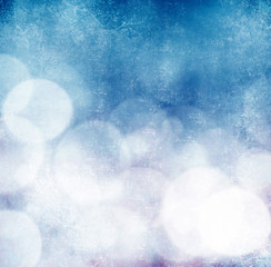 White bokeh on grungy blue background