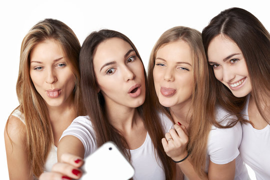 Girls making self portrait with a smartphone