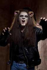 Male face of a Lion man in dark