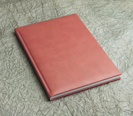 red  books in leather cover on a design paper, identity design,