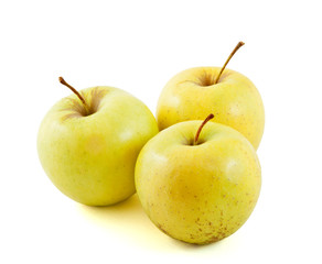 Three Golden delicious apples