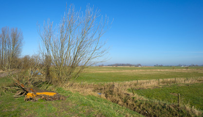 River with barge meandering through meadows