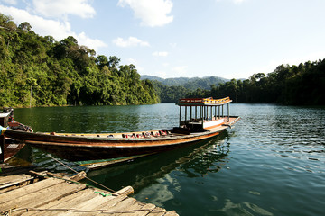 Obraz premium Wooden boats in ratchaprapa Dam,Khao Sok,Thailand