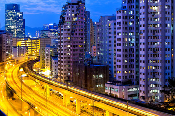Fototapeta na wymiar Urban traffic at night with modern buildings
