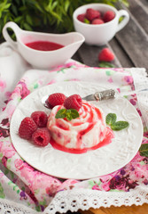 Obraz na płótnie Canvas Delicious dessert with raspberry sauce and fresh berries