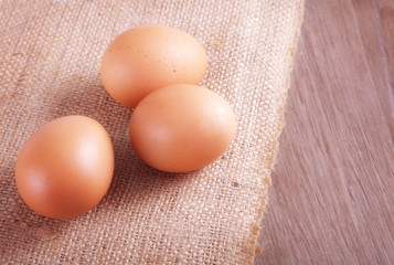 Eggs on burlap background