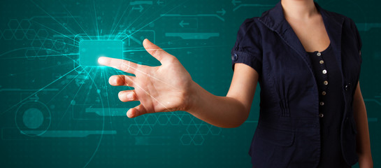 Woman pressing high tech type of modern buttons