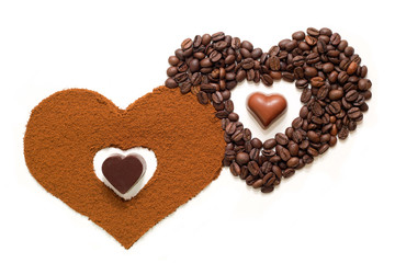 Hearts made of ground coffee, coffee beans and chocolate hearts