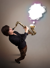 Young man playing on saxophone with copy space in white cloud