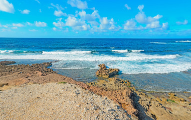 small waves and brown rocks