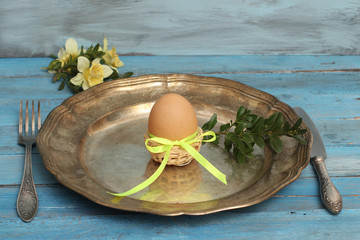 Table setting with cooked eggs, Easter time.