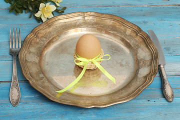 Table setting with cooked eggs, Easter time.