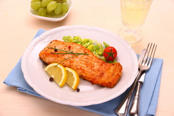 Grilled salmon, vegetables, grapes and wine