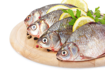 Fresh fishes with lemon, parsley and spice
