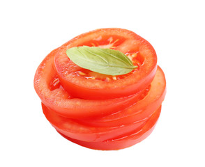 Slices of fresh tomato with basil, isolated on white