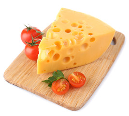 Piece of cheese and tomatoes, on wooden board, isolated on