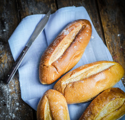 Bread rolls on rustic wooden background